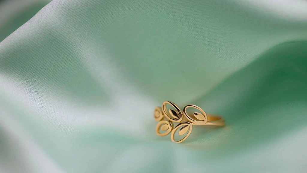 A solitaire engagement ring photographed on a Lyon jeweler's bench in natural morning light.